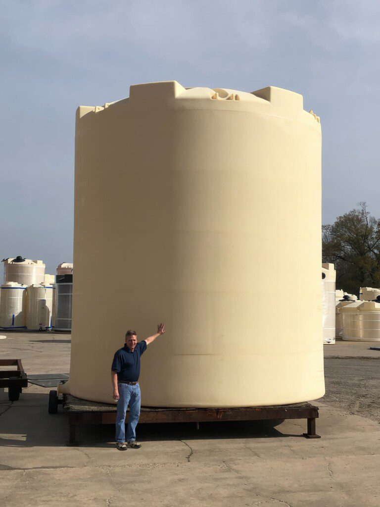 15,550 IMFO Full Discharge Tank - Person for scale